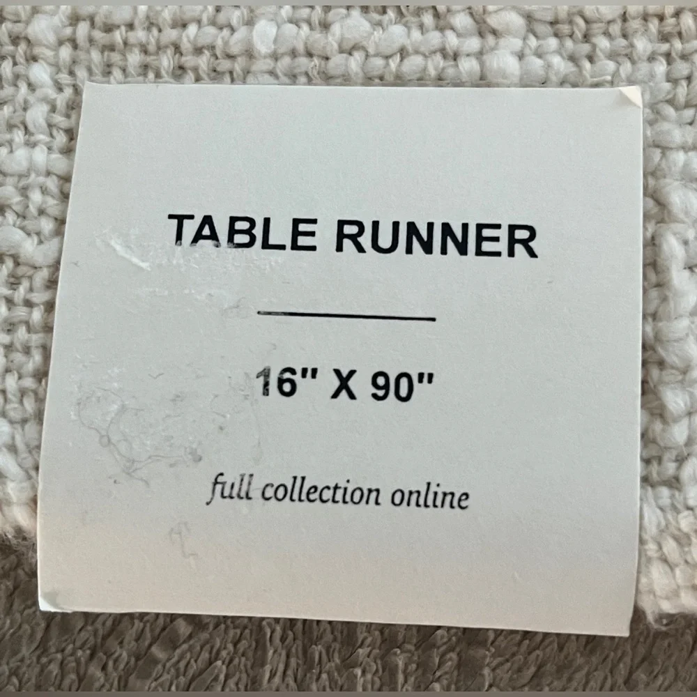 Anthropologie table runner in Cream and Pink/orange Tassel